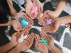 World cancer day. Hands of people holding ribbons
