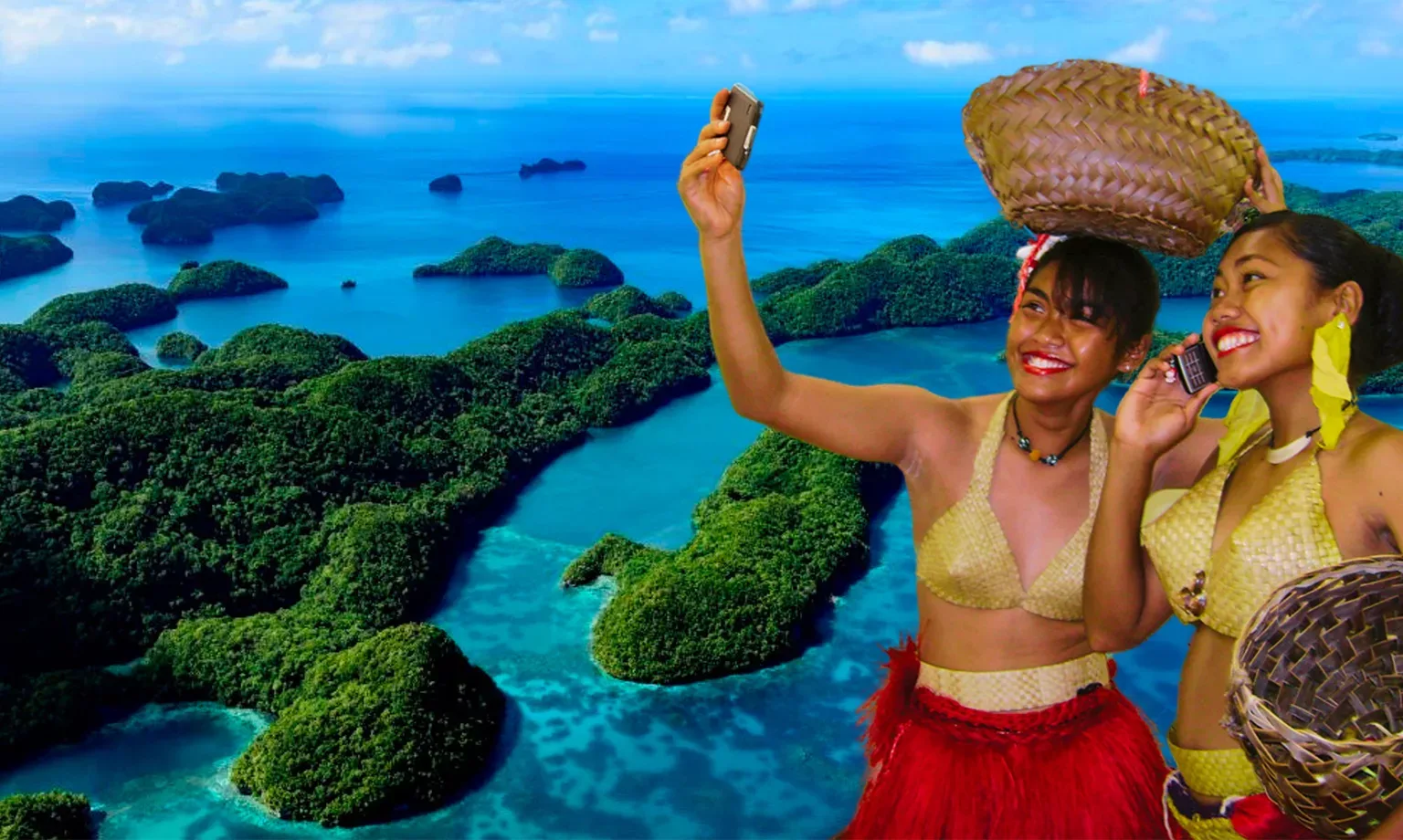 PNCC girls in Palauan costumes on phones at Rock Islands