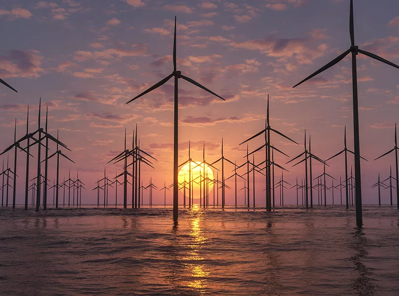 sunrise at an offshore wind farm