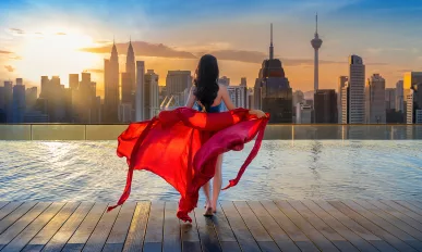 Beautiful girl enjoying view sunrise at Kuala lumpur, Malaysia.