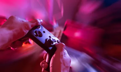 gamer playing game with controller