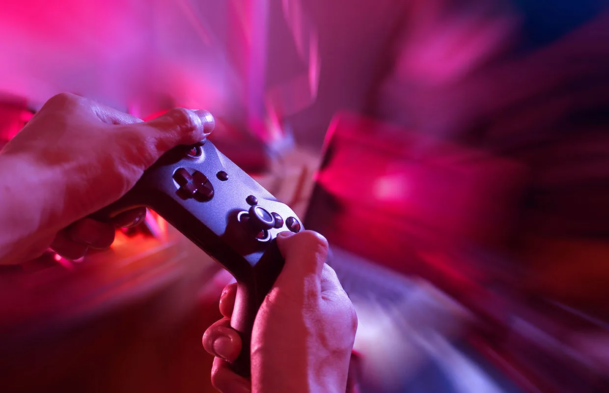 gamer playing game with controller